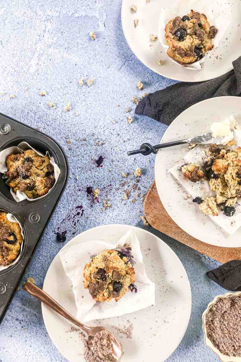 Blueberry Muffins on plates with butter