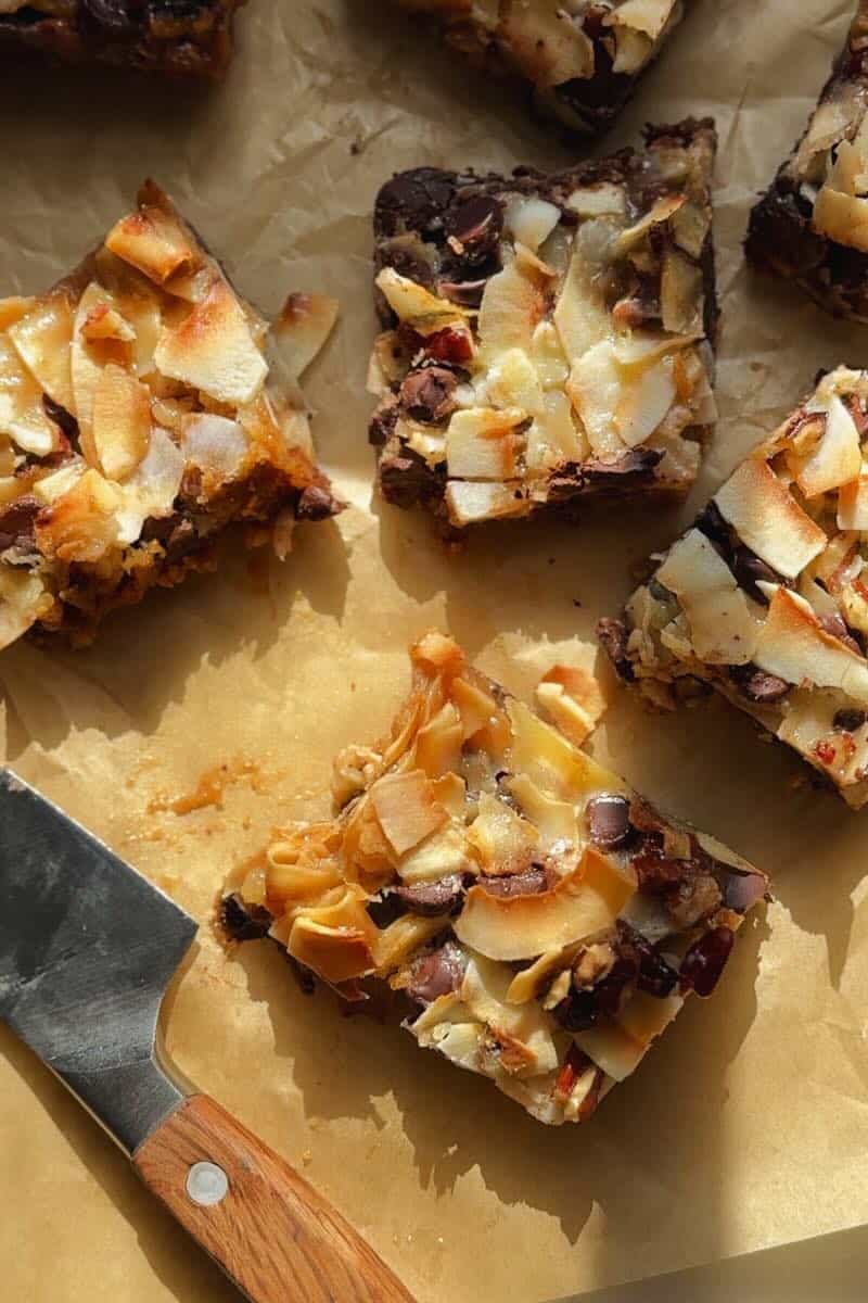 gluten free seven layer bars on parchment paper cut into squares