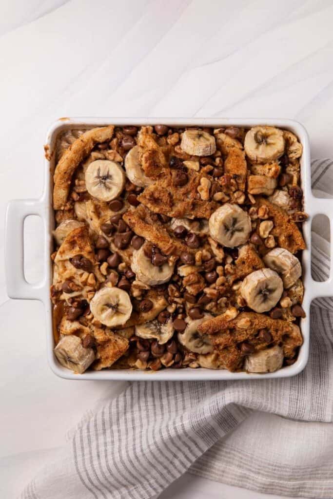 waffle casserole in a white dish with a striped napkin