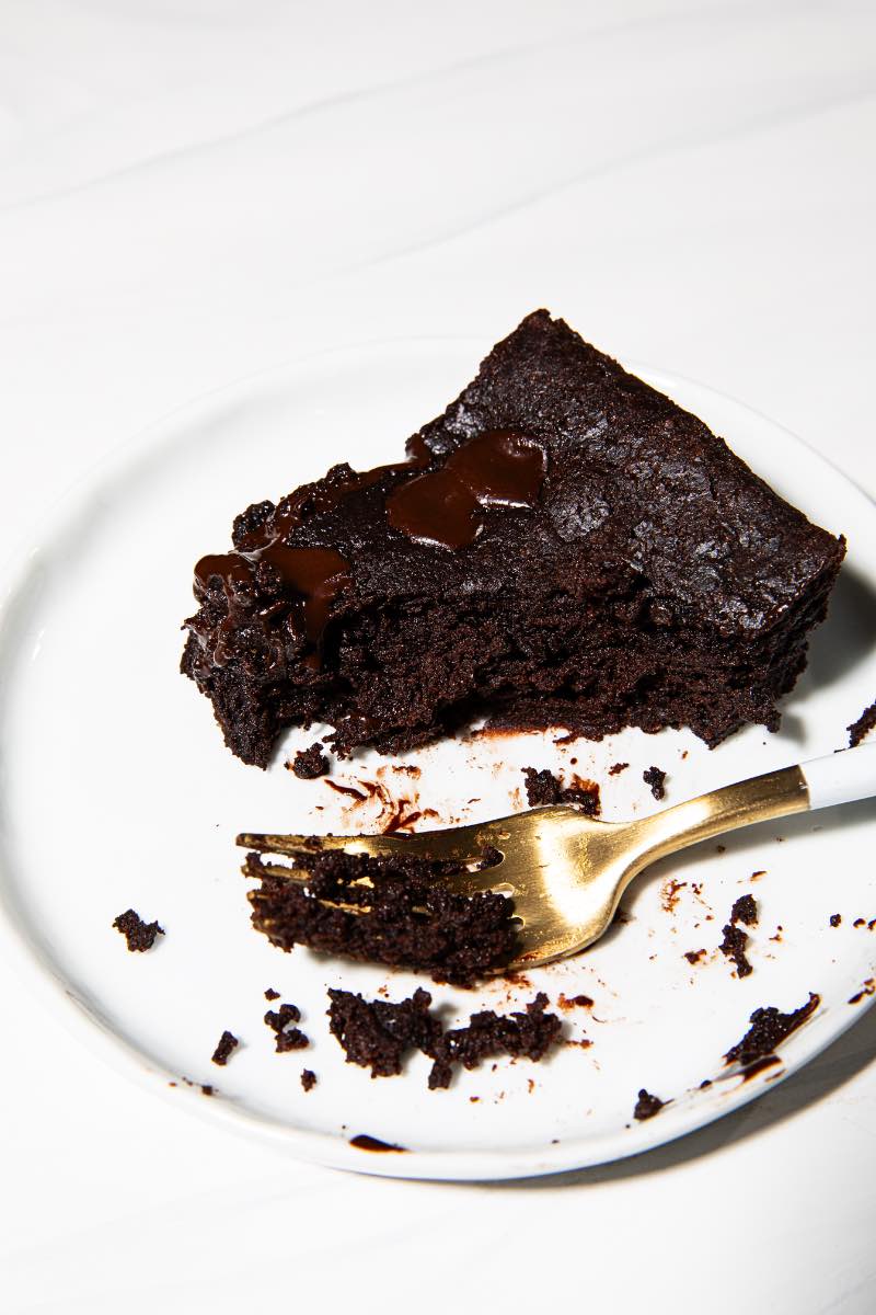 cottage cheese brownie on a plate with a large bite taken out
