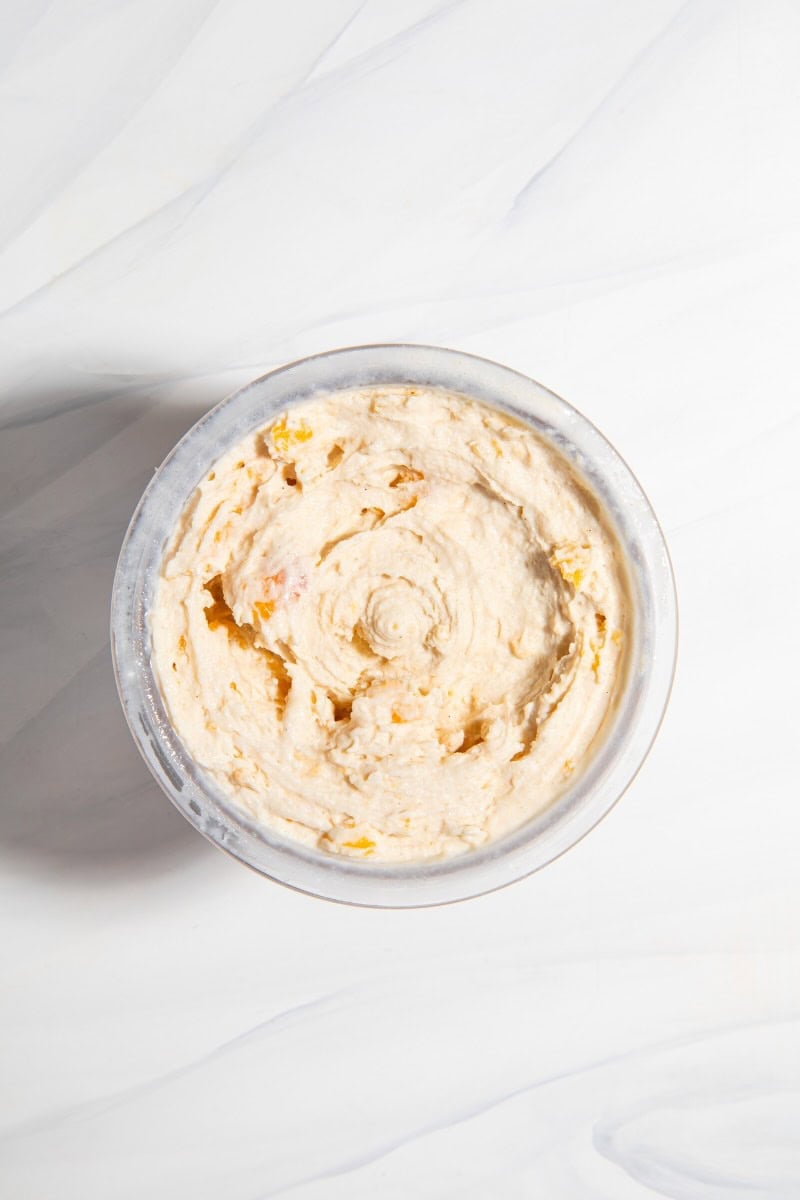 ninja creami peach ice cream in a pint container