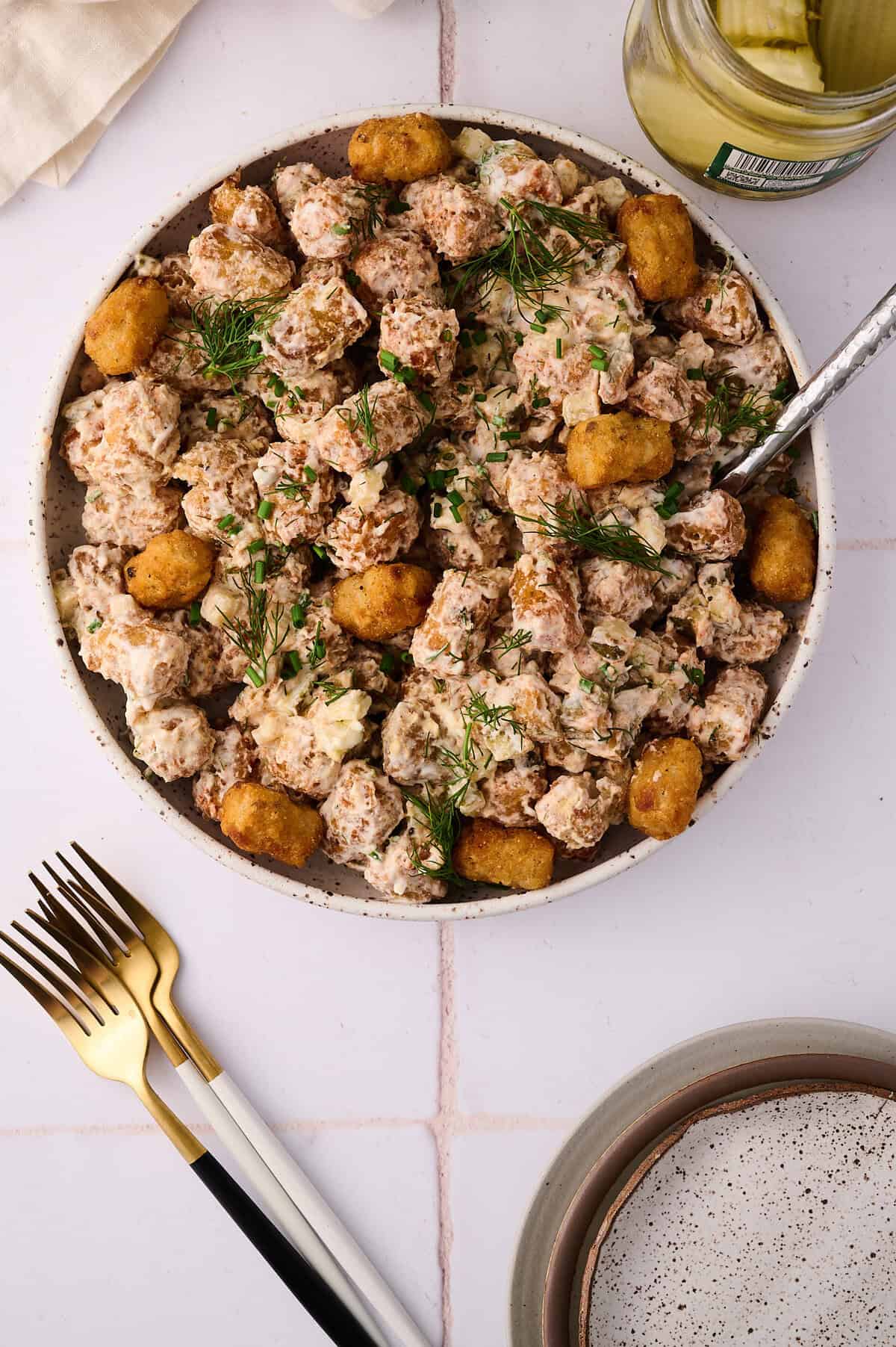tater tot potato salad in a serving bowl
