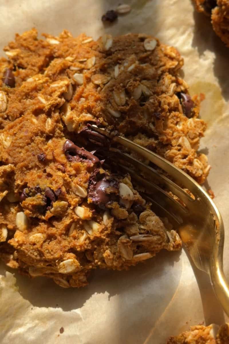 fork cutting into a pumpkin oatmeal cookie