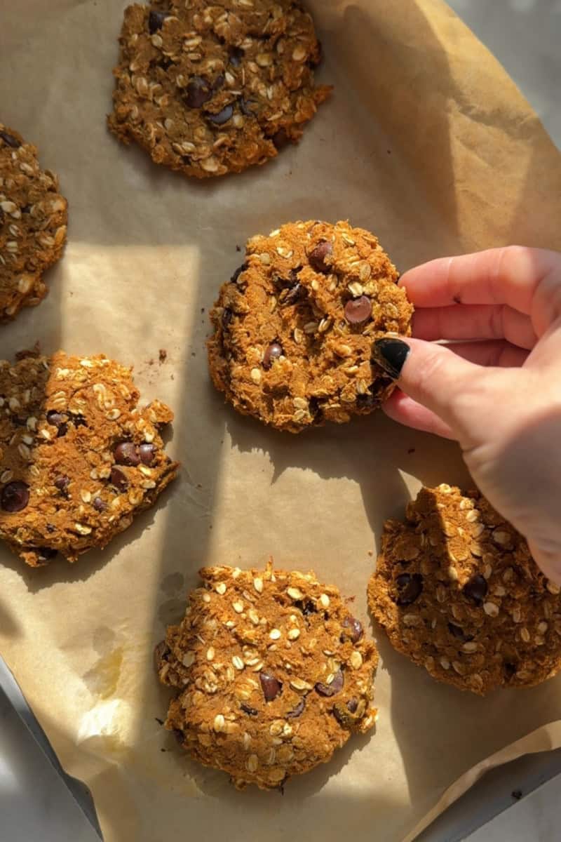 gluten free pumpkin oatmeal cookies on a parchment lined tray