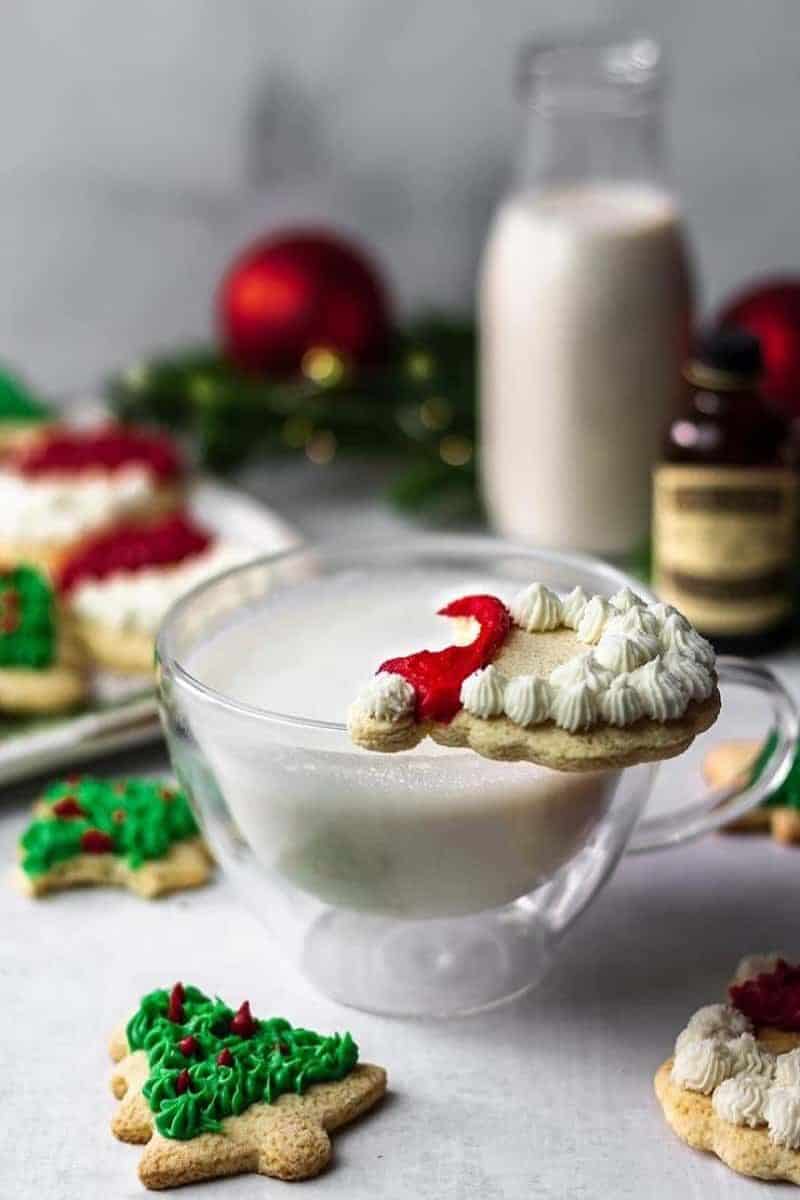 gluten free christmas cut out cookies decorated with a glass of milk