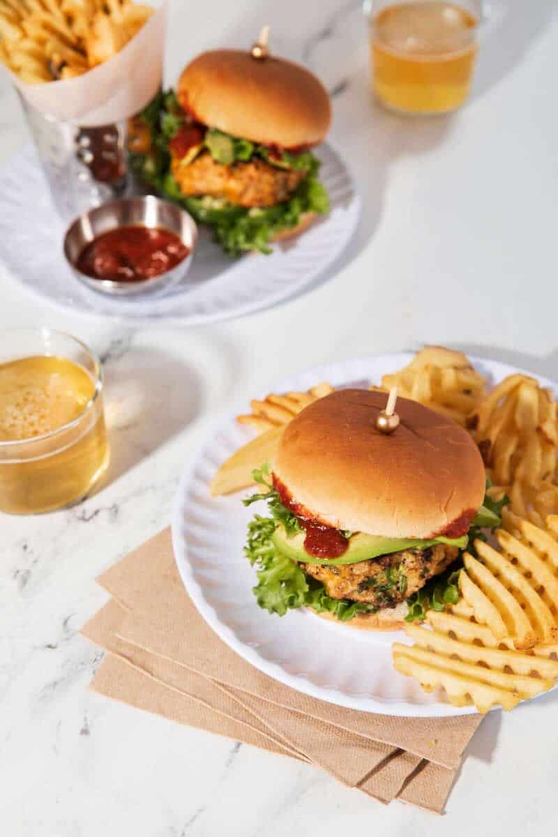 chipotle chicken sliders on plates with waffle fries
