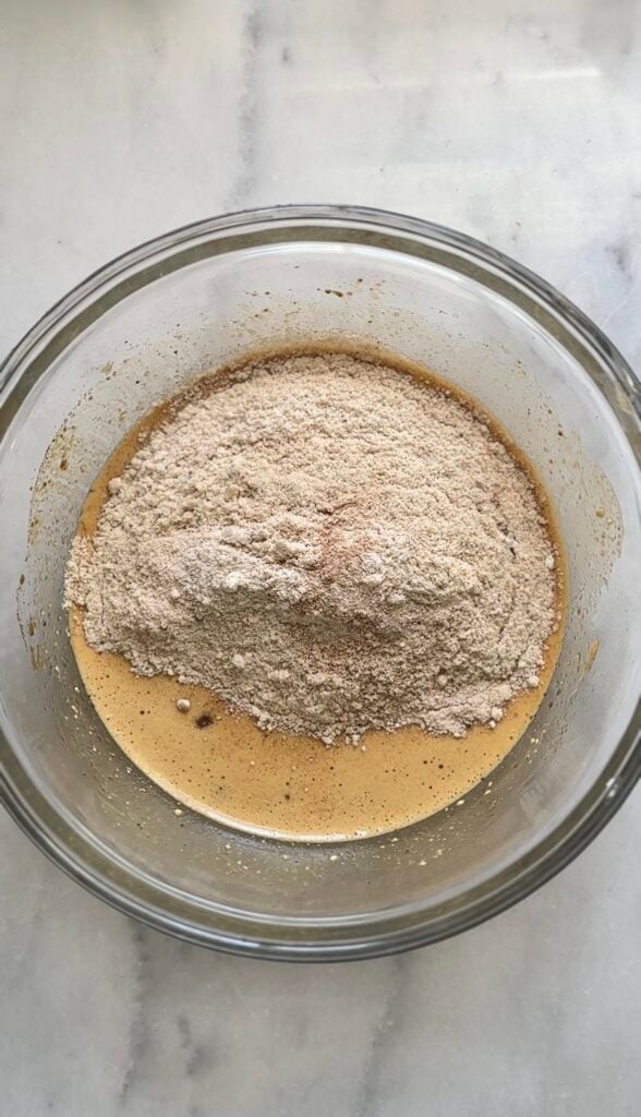 Mix the dry ingredients into the wet ingredients of the high protein carrot cake into a bowl.