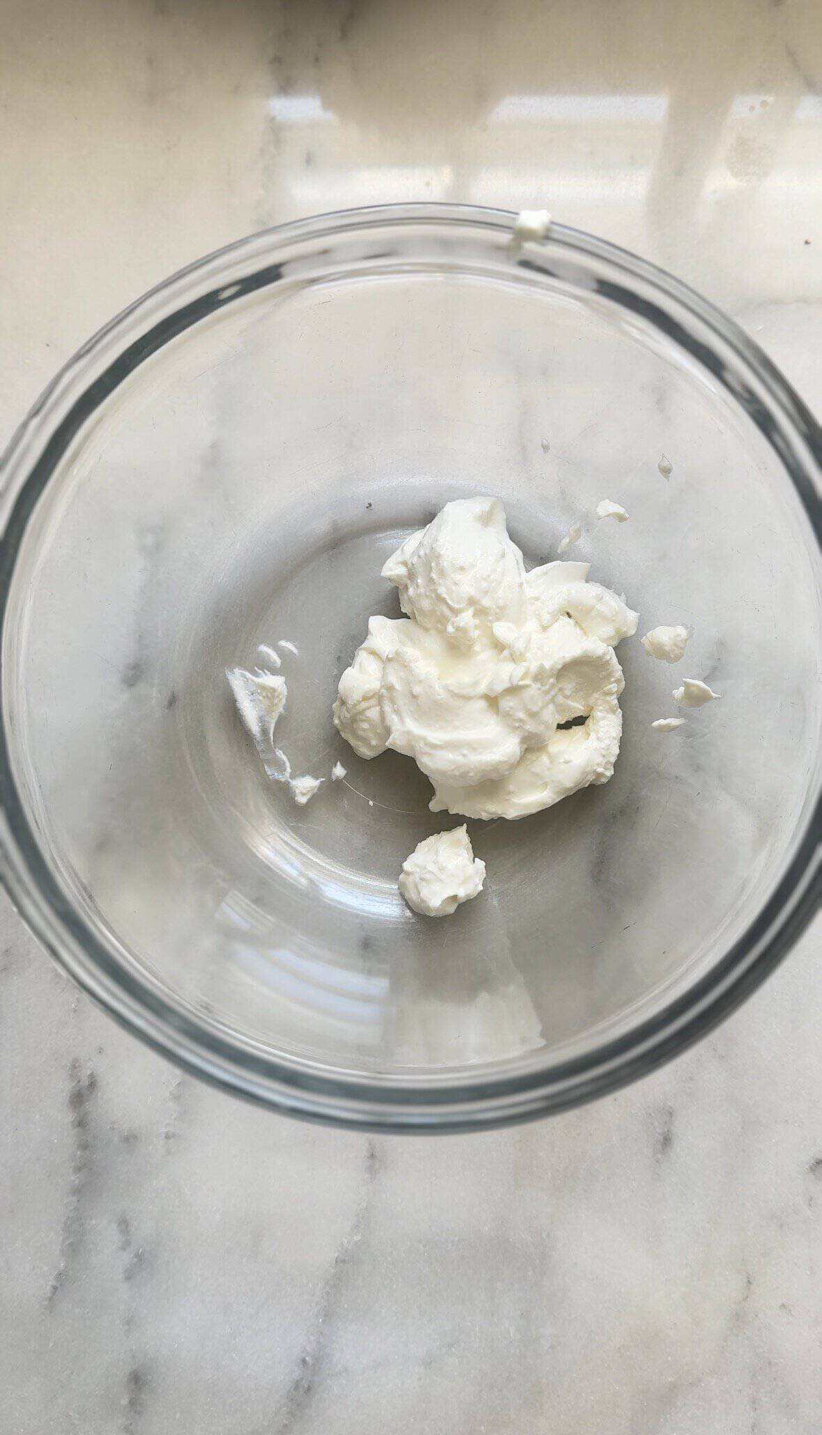 Whipped cottage cheese in a bowl for the high protein carrot cake.