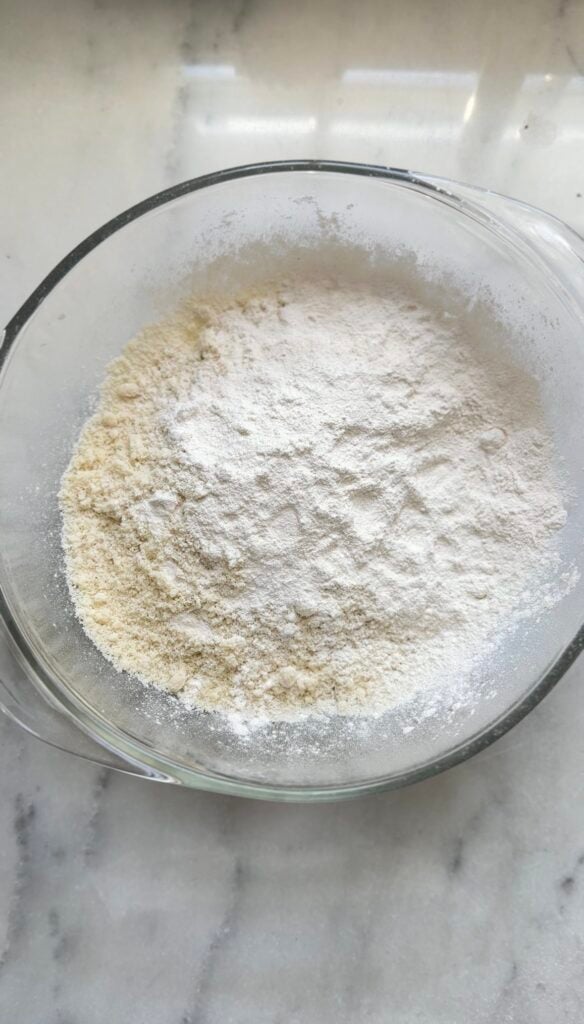 Measure the dry ingredients of the high protein carrot cake into a bowl.