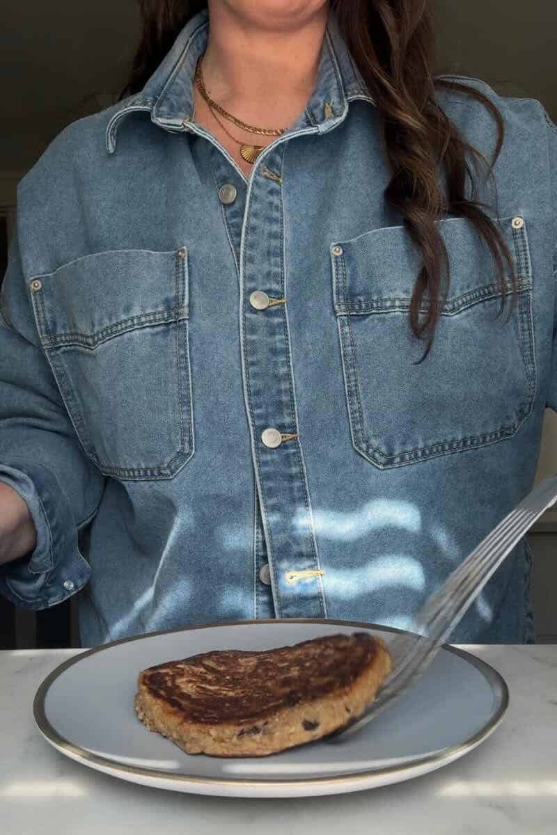 Gluten free blueberry oatmeal protein pancakes being plated after being cooked on a large skillet.