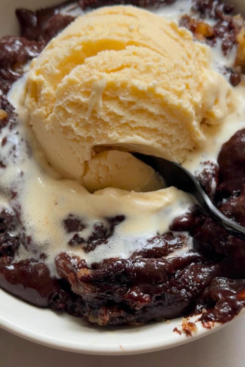 close up of protein skillet brownie with melty ice cream