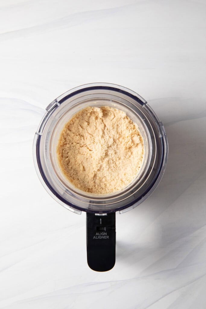 Mix the frozen peanut protein ice cream base in the Ninja Creami pint jar for the first spin on the "lite ice cream" function.
