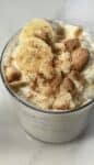 Finished protein banana pudding topped with banana slices and crushed up gluten free vanilla wafers.