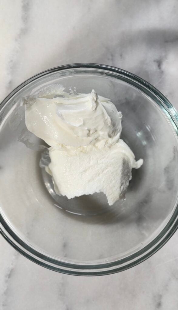 Protein-packed yogurt for the easy protein banana pudding in a bowl.