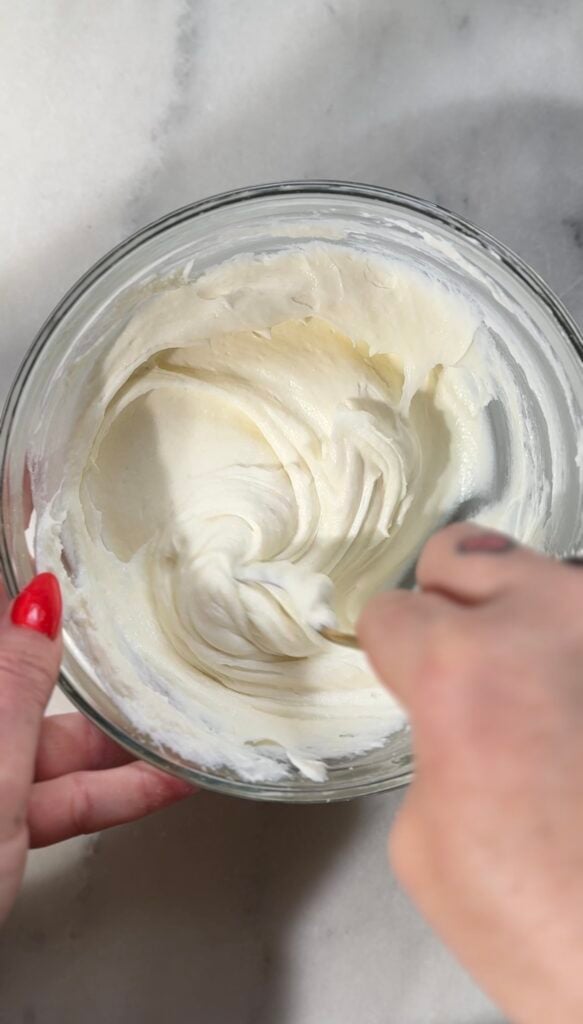 Mix the protein-packed yogurt and protein powder for the easy protein banana pudding in a bowl.