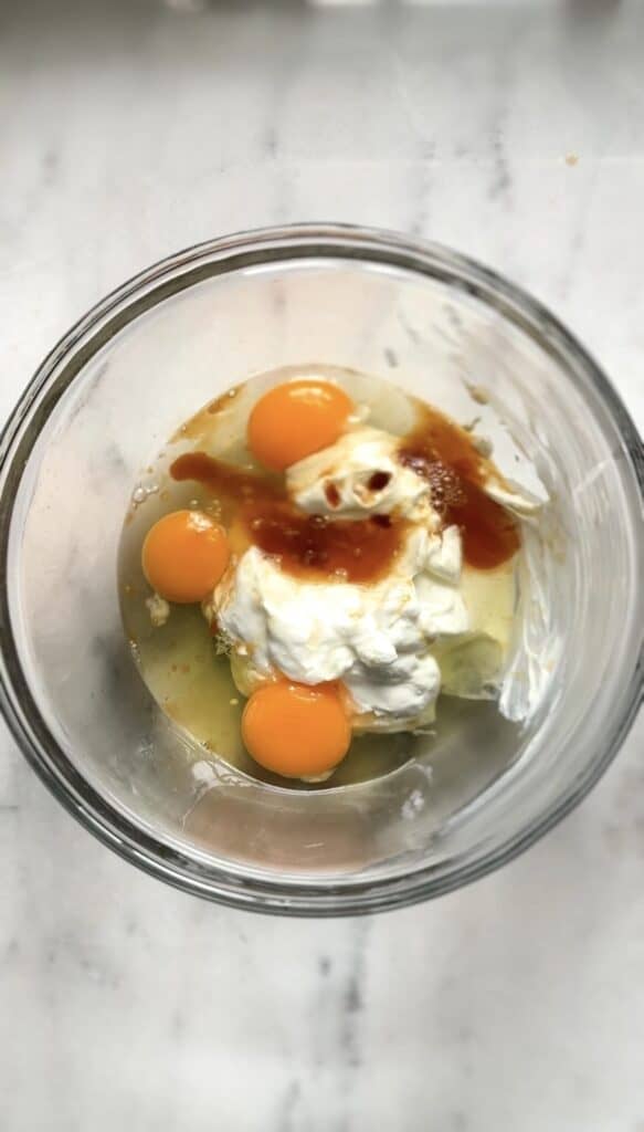 All the wet ingredients for the protein lemon cake in a bowl.