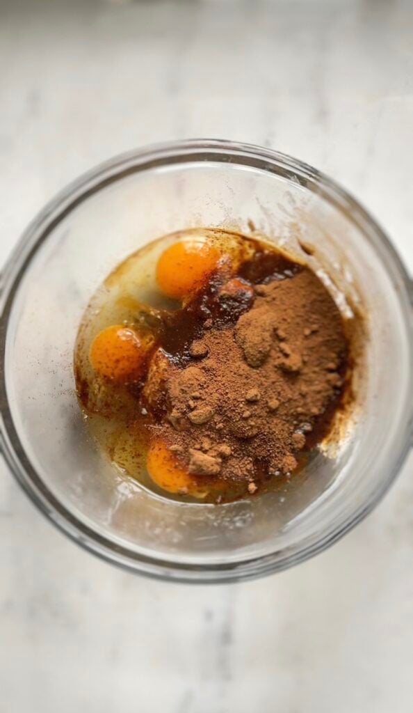 All the wet ingredients plus the coconut sugar for the protein lemon cake in a bowl.