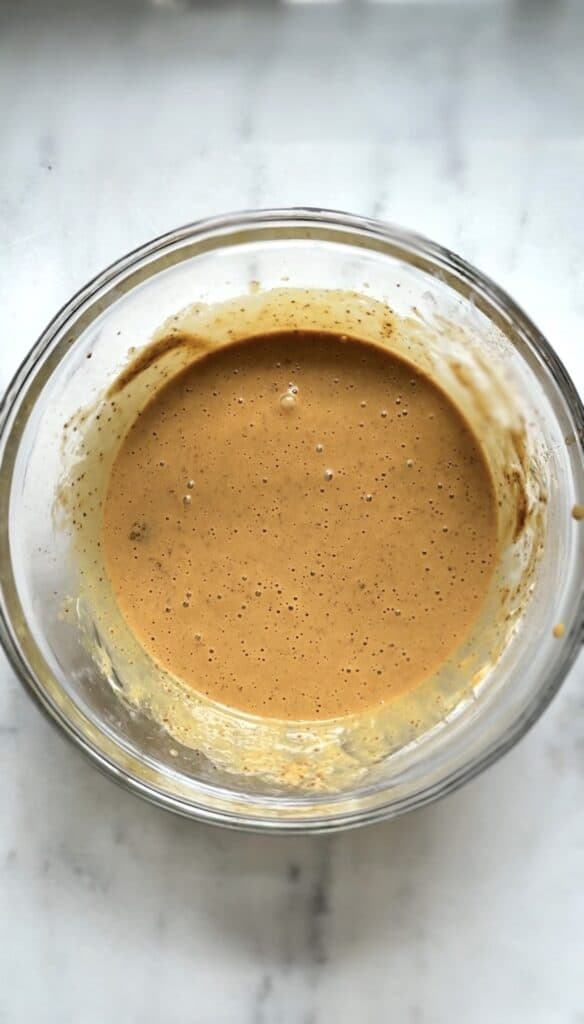 All the wet ingredients plus the coconut sugar for the protein lemon cake mixed together in a bowl.