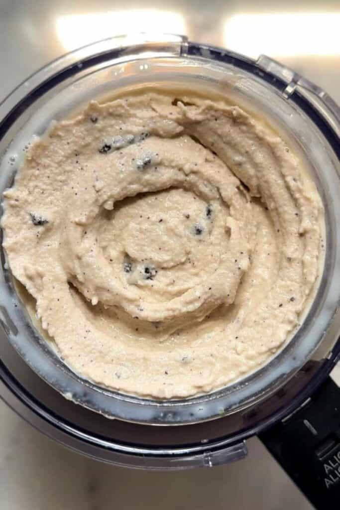Blend Oreos in the frozen base of the Ninja Creami Protein Dairy Free Oreo Cookies and Cream Ice Cream in the ninja creami pint.