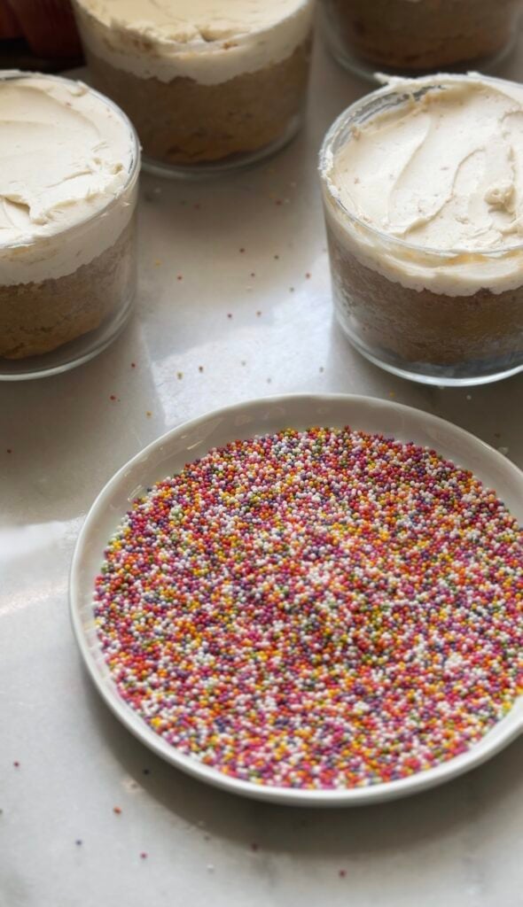 Pour the rainbow round sprinkles in a dish.