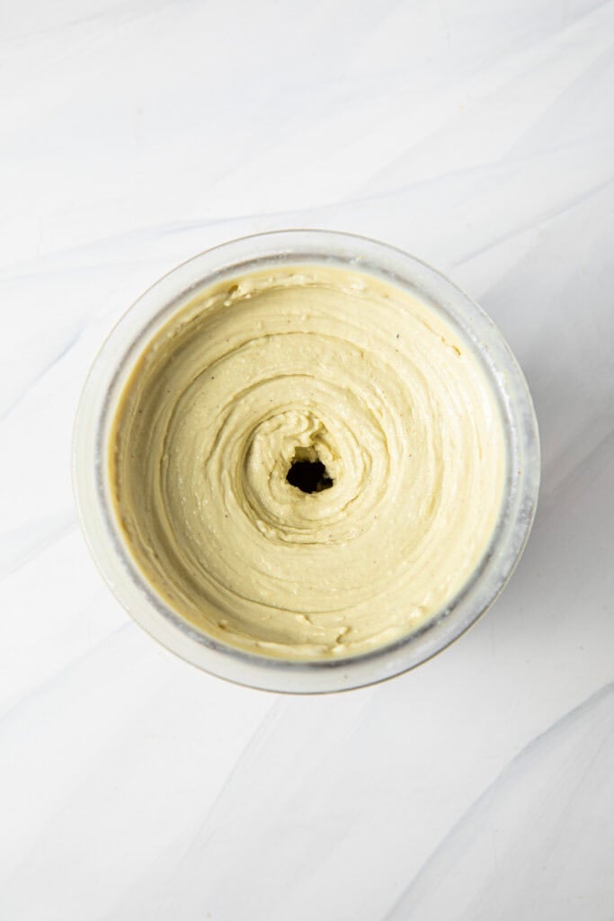 Pistachio ninja creami ice cream in a ninja creami pint.