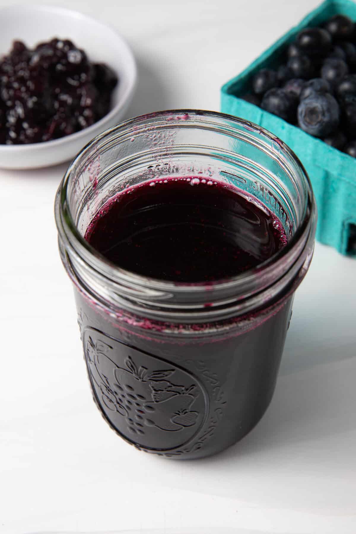 Fresh Blueberry Simple Syrup in a mason jar.