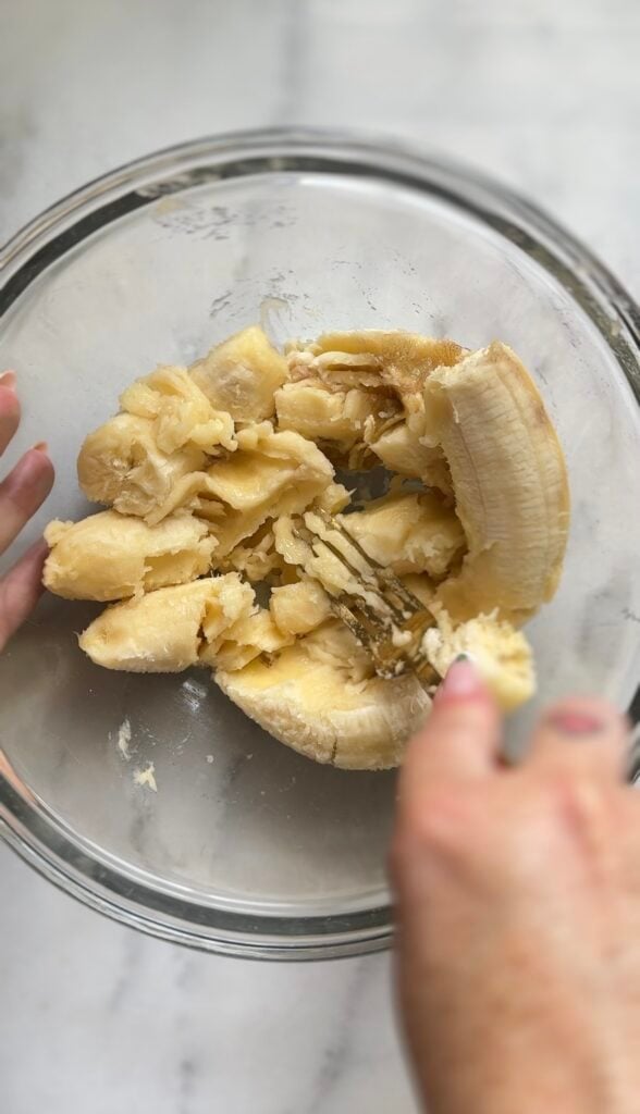 Mash the 3 fresh ripe bananas in a bowl for the Gluten Free Protein Banana Nut Bread.