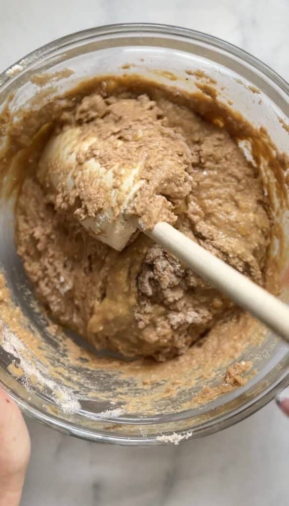 Mix the dry ingredients and the wet ingredients together for the Gluten Free Protein Banana Nut Bread batter.