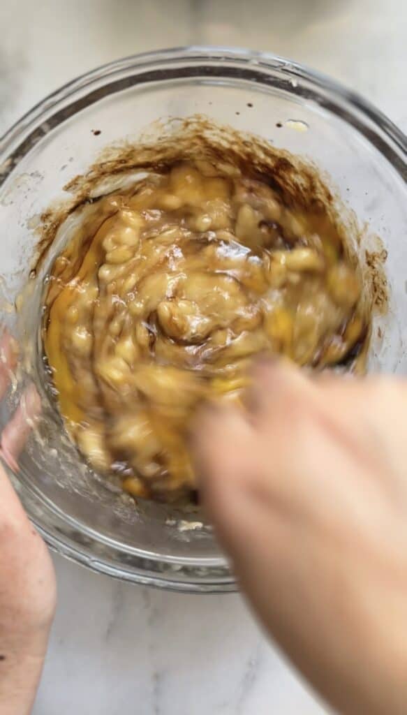 Mixing the wet ingredients for the Gluten Free Protein Banana Nut Bread batter.