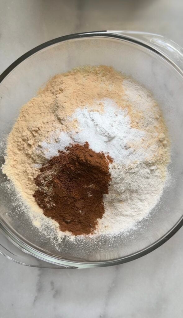Add the dry ingredients in a bowl for the Gluten Free Protein Banana Nut Bread batter.