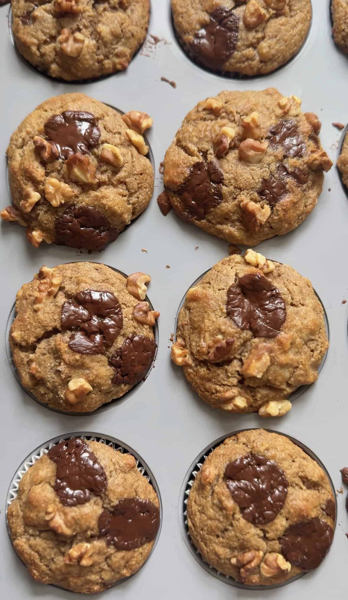 Protein Cottage Cheese Banana Muffins in the muffin tin lined with parchment paper liners.