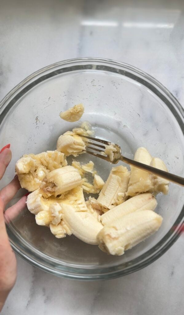 Mash the bananas for the Protein Cottage Cheese Banana Muffins.