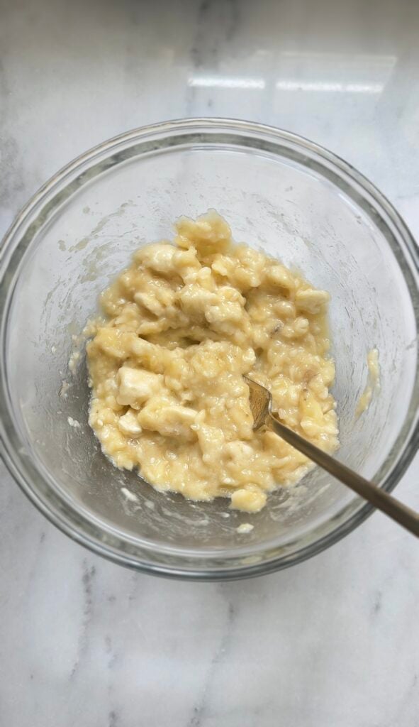Mashed bananas in a bowl for the Protein Cottage Cheese Banana Muffins.