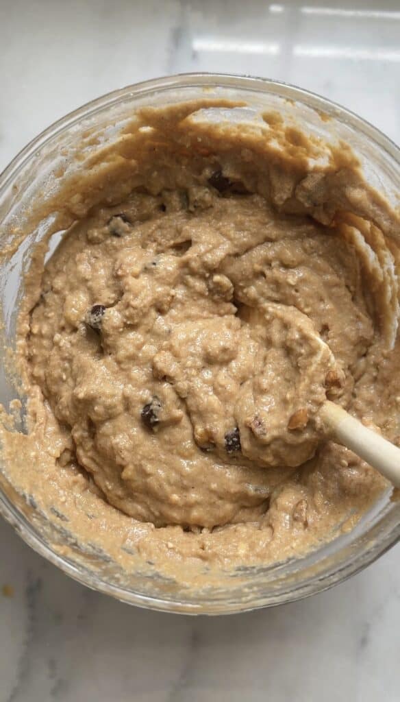 Folded chocolate chips and nuts in the Protein Cottage Cheese Banana Muffins batter.