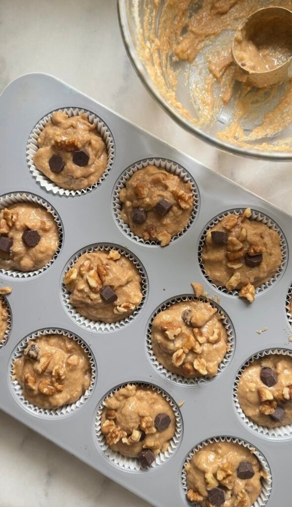 Raw Protein Cottage Cheese Banana Muffins batter in the muffin tin.