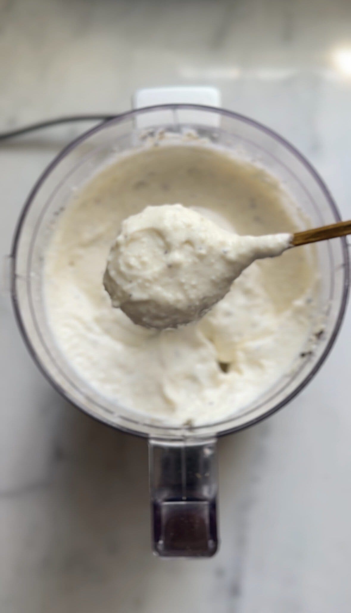 Cacio e pepe mac and cheese cottage cheese sauce in food processor bowl.