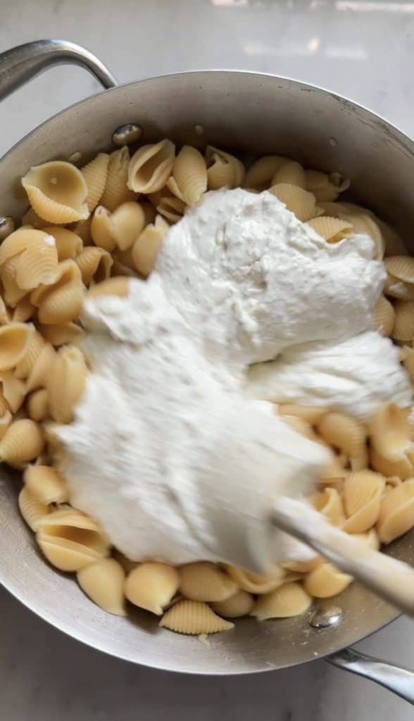 Mix the Cacio e pepe cottage Cheese Mac & Cheese sauce into the protein pasta.