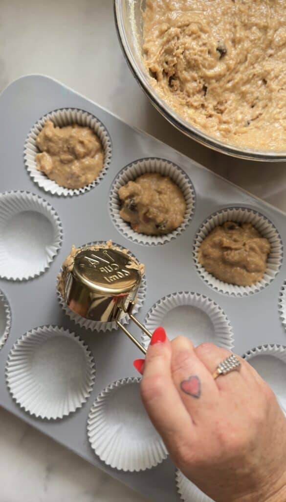 Scoop ¼ cup of the Protein Cottage Cheese Banana Muffins batter into each muffin tin.