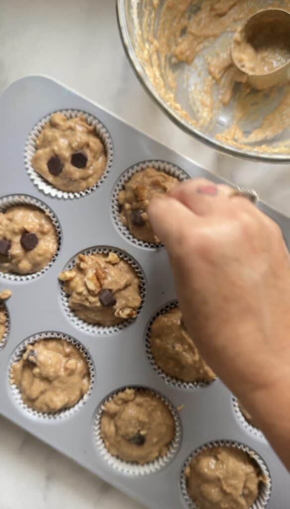 Top with Protein Cottage Cheese Banana Muffins with chocolate and nuts.