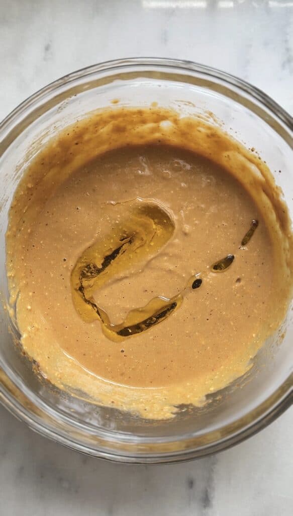 Add avocado oil to the Gluten Free Protein Pumpkin Bread batter.
