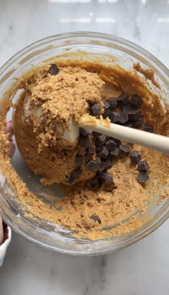 Fold in the chocolate chips into the Gluten Free Protein Pumpkin Bread batter.