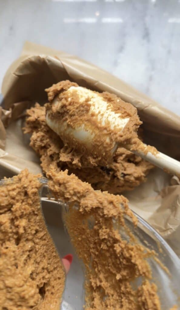 Scoop the the Gluten Free Protein Pumpkin Bread batter into the loaf pan.