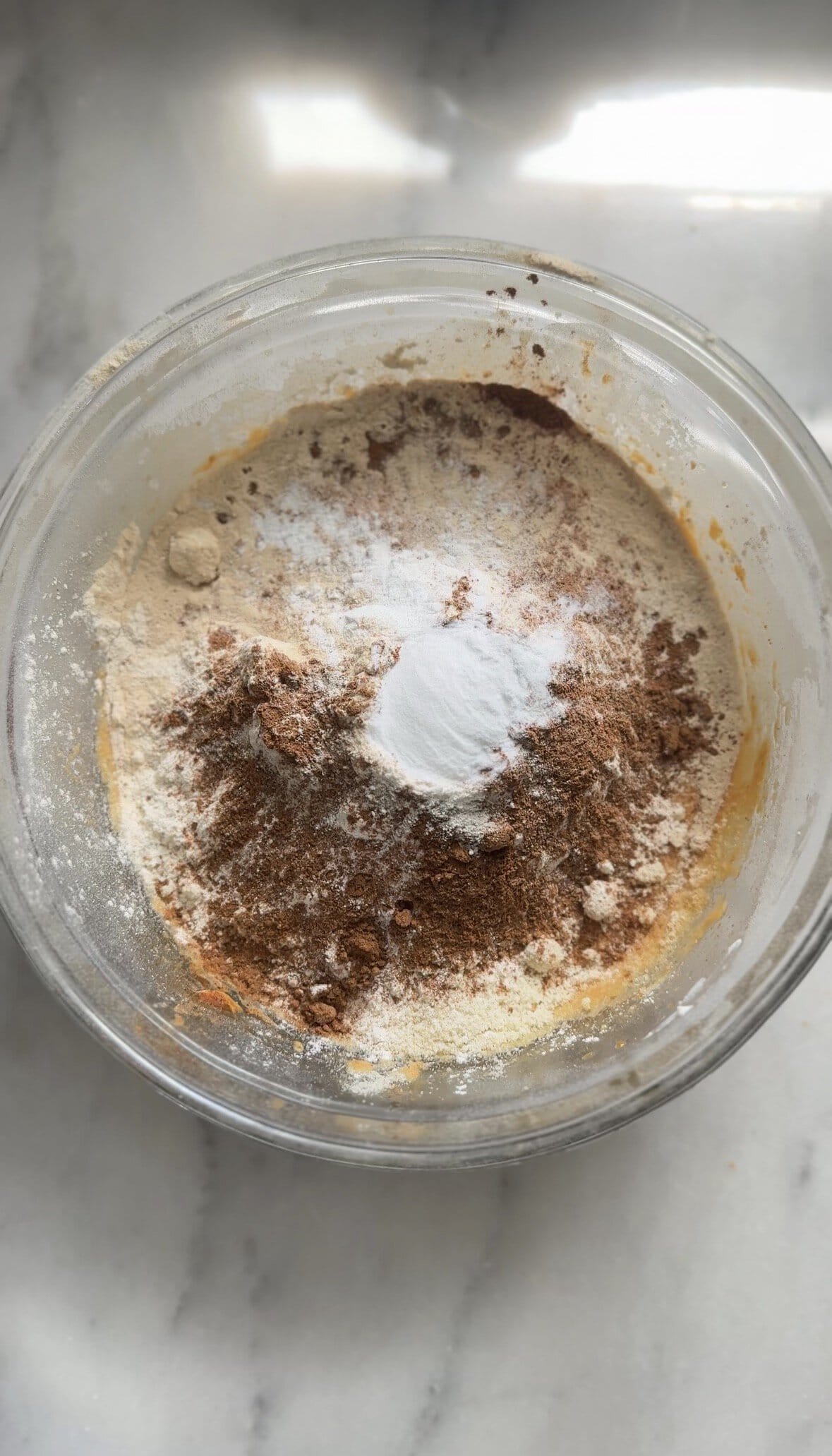 Add the dry ingredients to the wet ingredients of the pumpkin cottage cheese muffins into the same bowl.