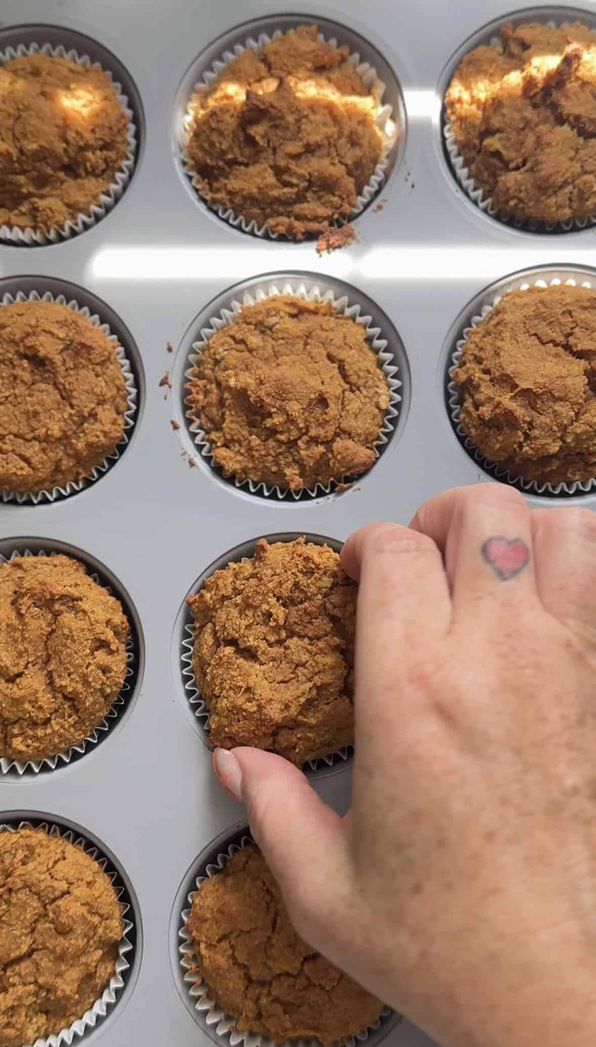 Baked pumpkin cottage cheese muffins in the muffin tin.