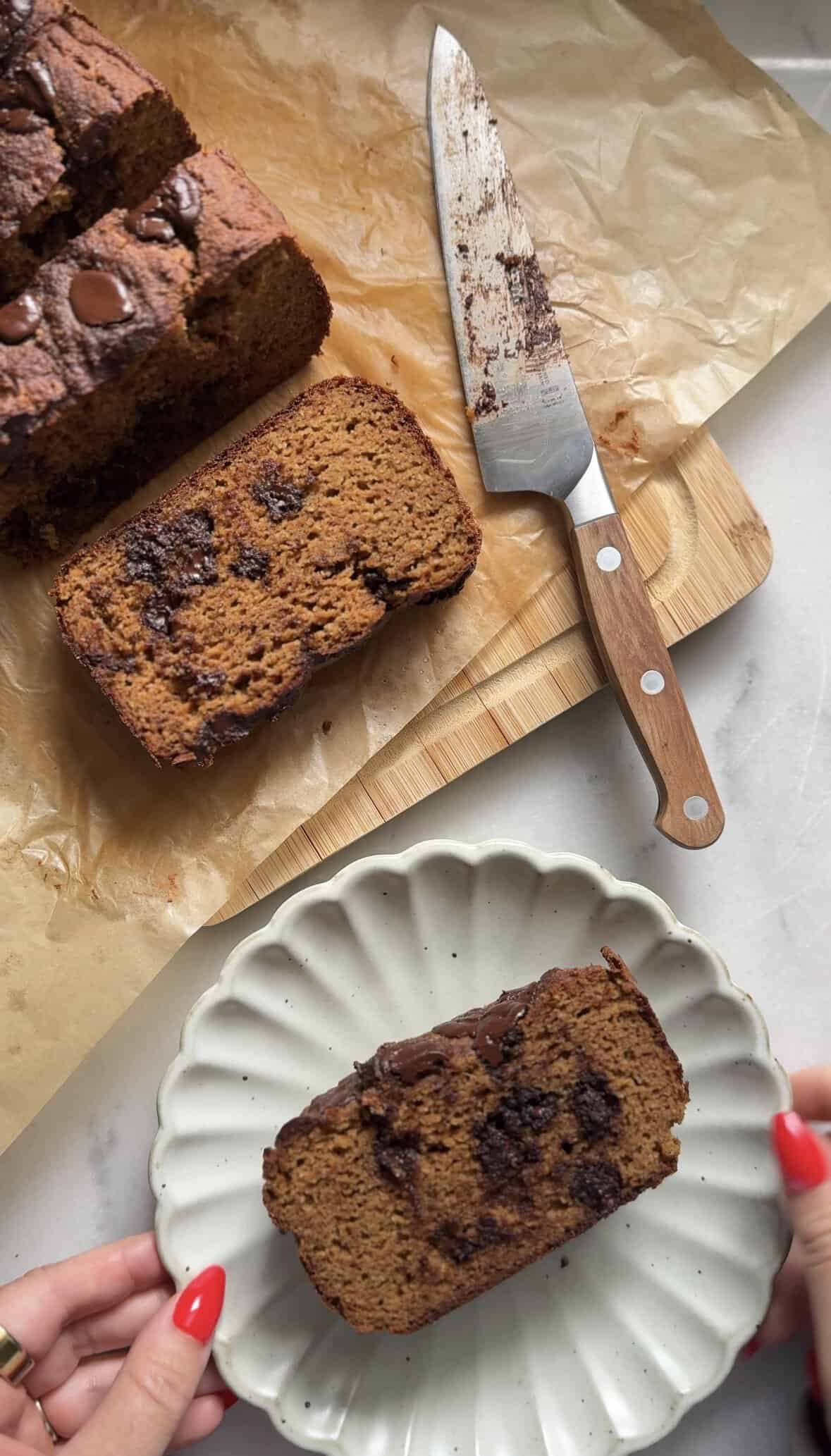 Sliced Gluten Free Protein Pumpkin Bread with a knife.