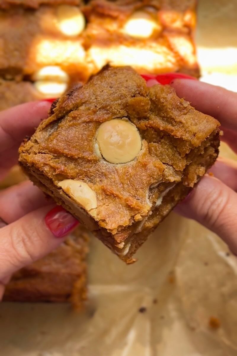 hand holding pumpkin cottage cheese blondies