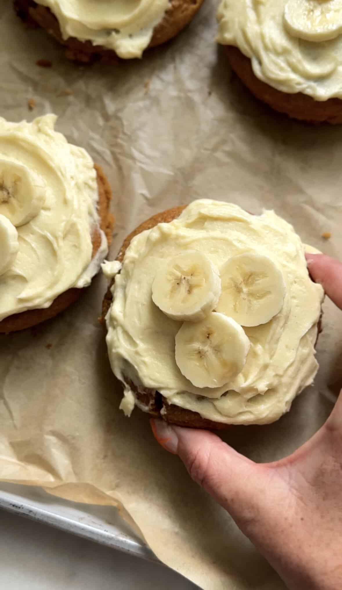 Close up of the Guten Free Baked Banana Donuts topped with fresh sliced bananas.
