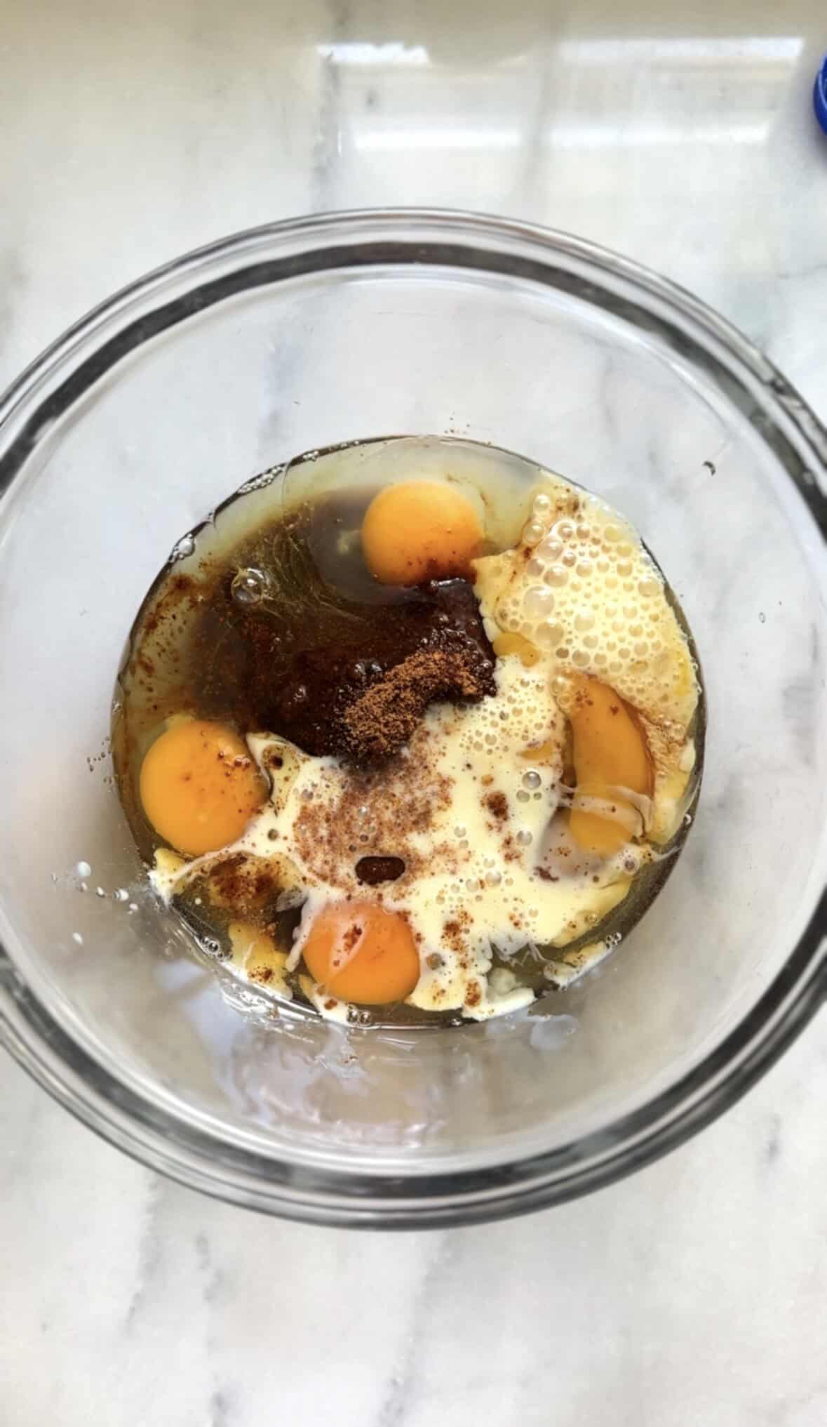 Add the wet ingredients of the banana donuts into a bowl.