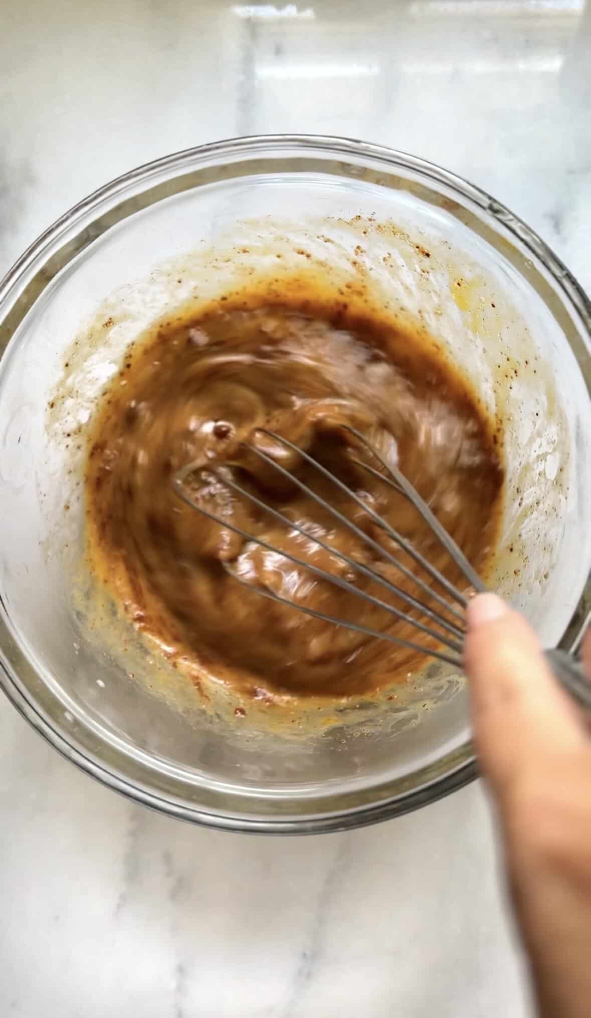 Mix the wet ingredients of the banana donuts in a bowl.