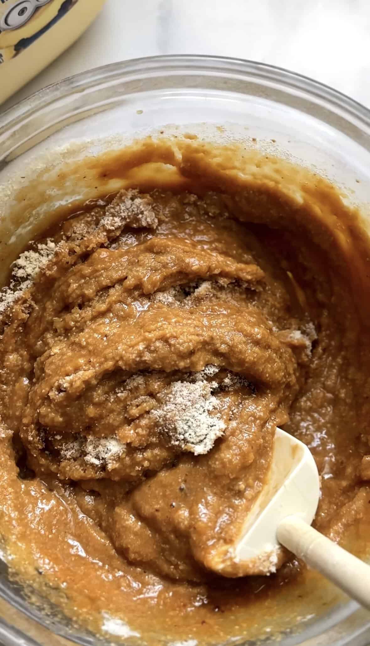 Fullly mix the dry ingredients of the banana donuts into the same bowl as the wet ingredients until all combined.